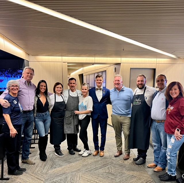 Image: Team and guests at the game